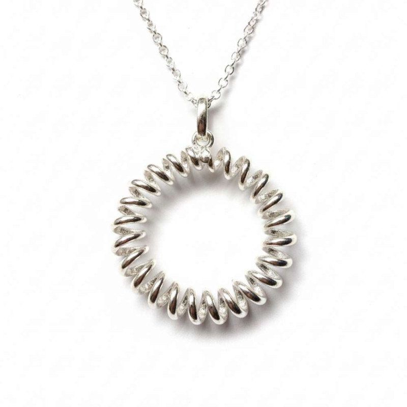 Circular silver pendant