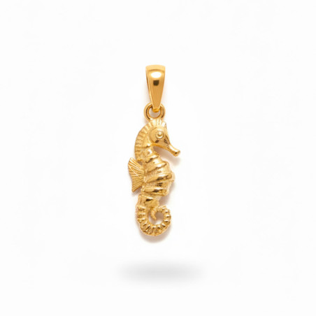 gold pendant in the shape of a seahorse