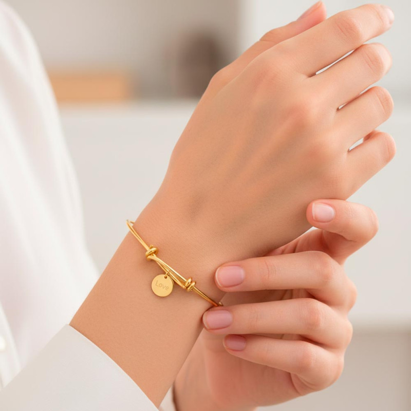 Gold bracelet with engraved medallion