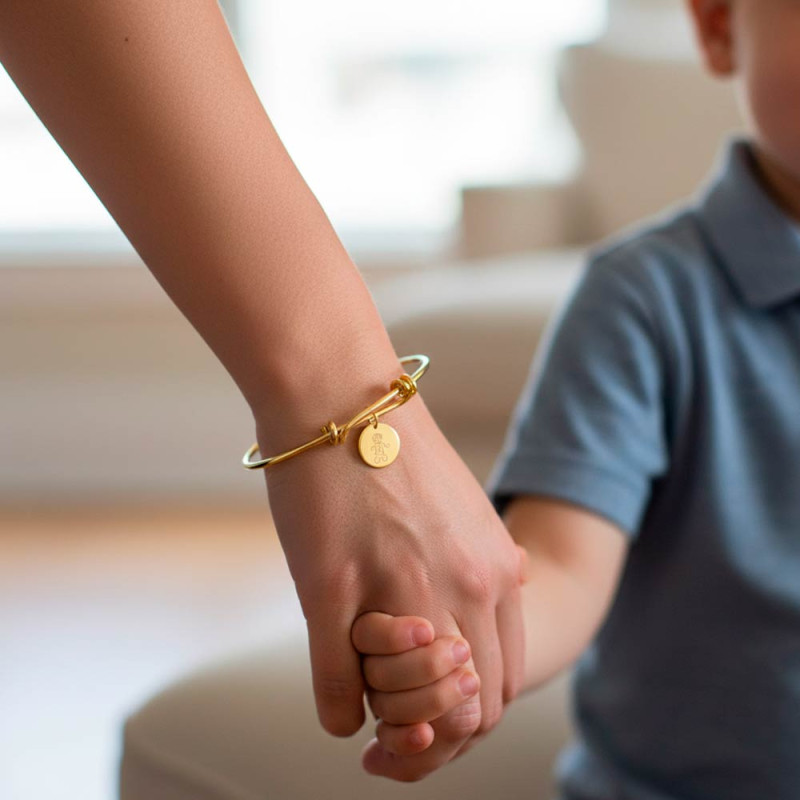 Gold bracelet with engraved medallion design