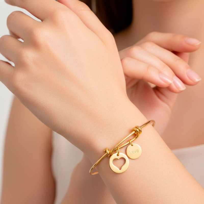 Gold bracelet with two charms