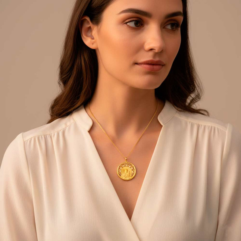 Gold necklace with a medal featuring the Virgin of Carmen and precious stones