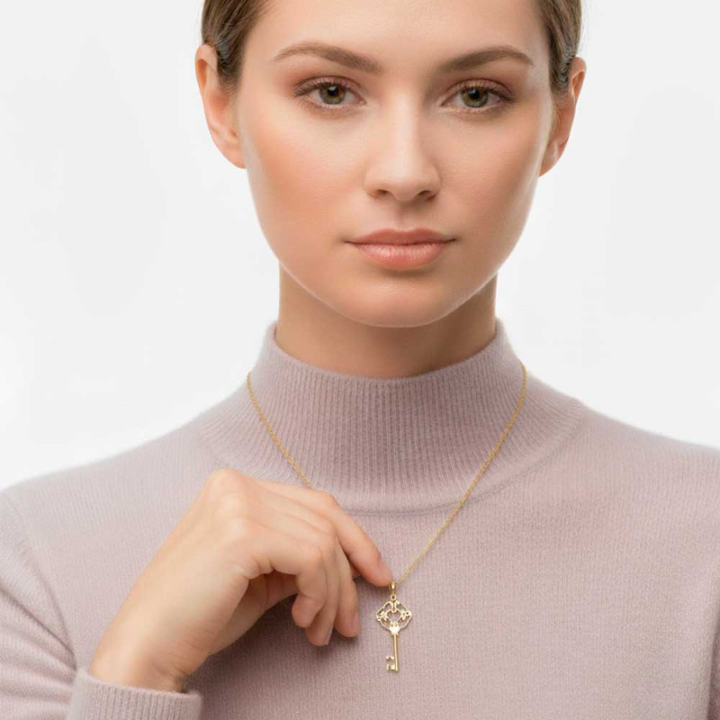 Gold key pendant with initials