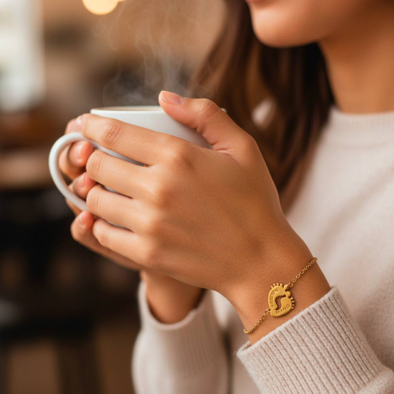 Personalized bracelet with gold footprints and names