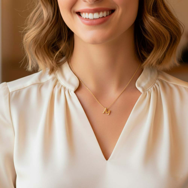 Initial M necklace in gold