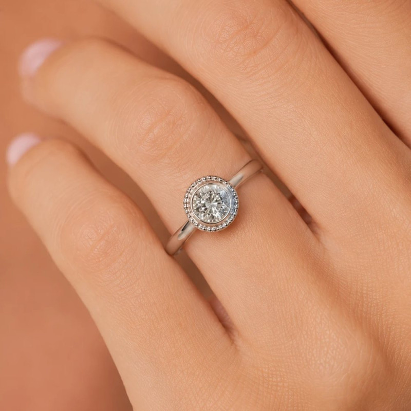 White gold diamond solitaire ring worn on the hand