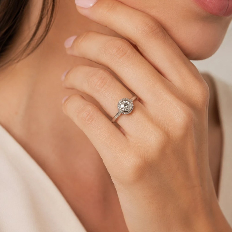White gold diamond engagement ring with beaded halo