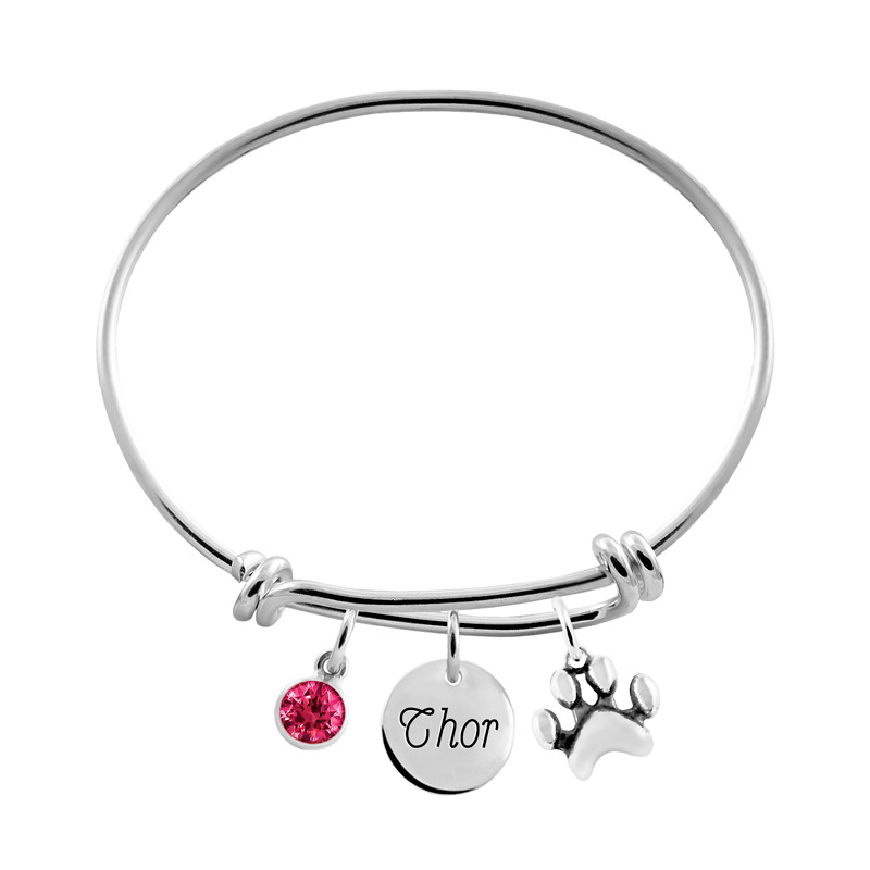 pulsera plata con charm huella y circonita roja