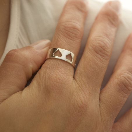 Hand with silver heart ring