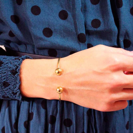 Pulsera dorada abierta con dos bolas