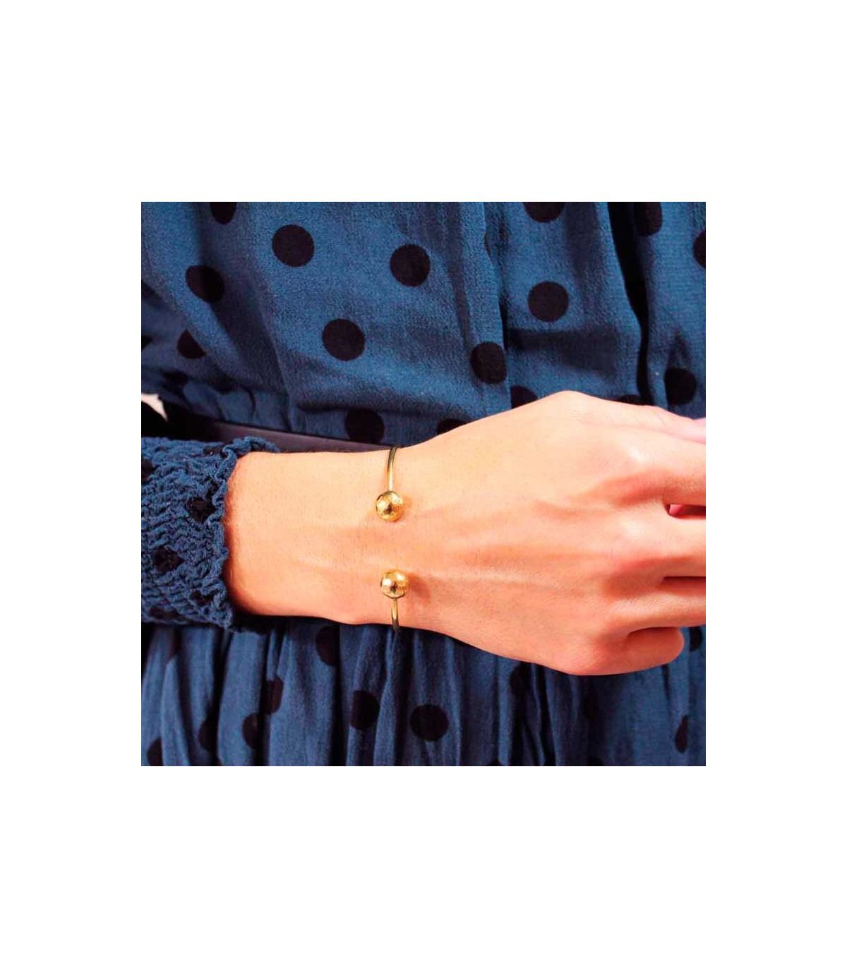 Bracelet with two balls meaning discount