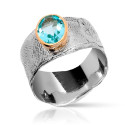 Anillo cera con cerco de oro y topacio