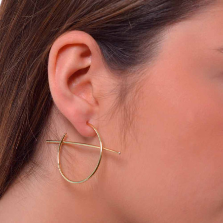 Women's earrings with golden hoops in silver