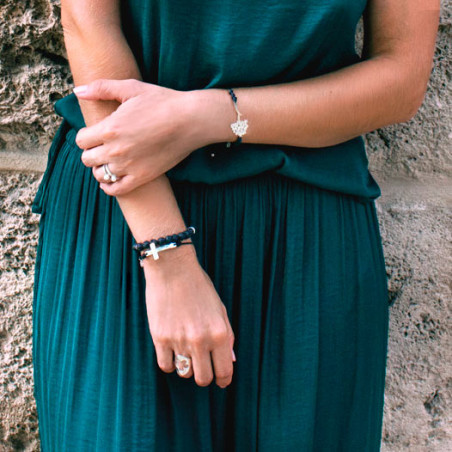 Cross bracelet mounted on leather