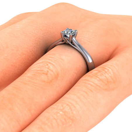 Hand with white gold diamond engagement solitaire