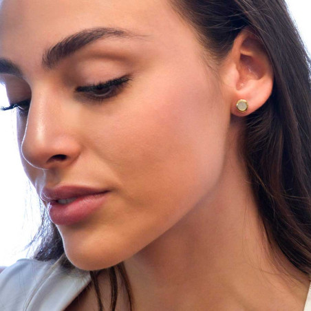 Women's gold earring with mother-of-pearl.