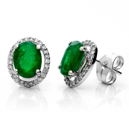 White gold earrings mounted with a central emerald and diamonds around