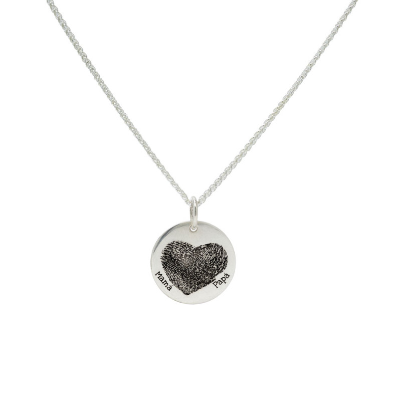 Silver necklace with a heart-shaped footprint.