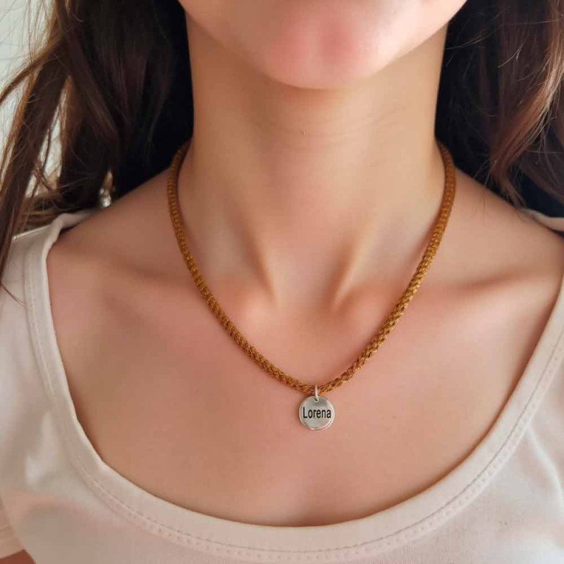 Necklace with Lorena medal and brown mesh.