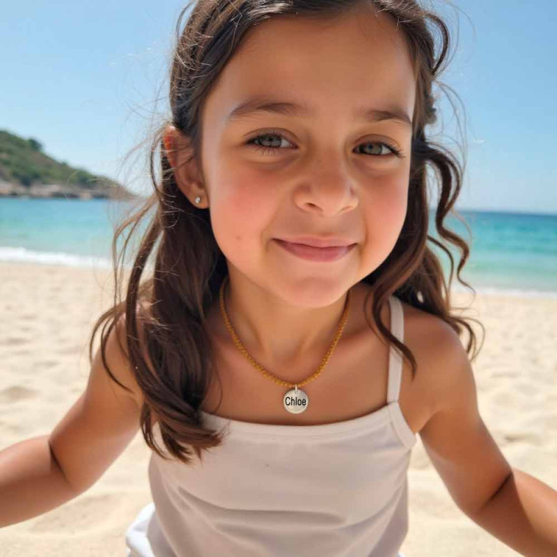Girl's necklace with name medal and brown mesh.