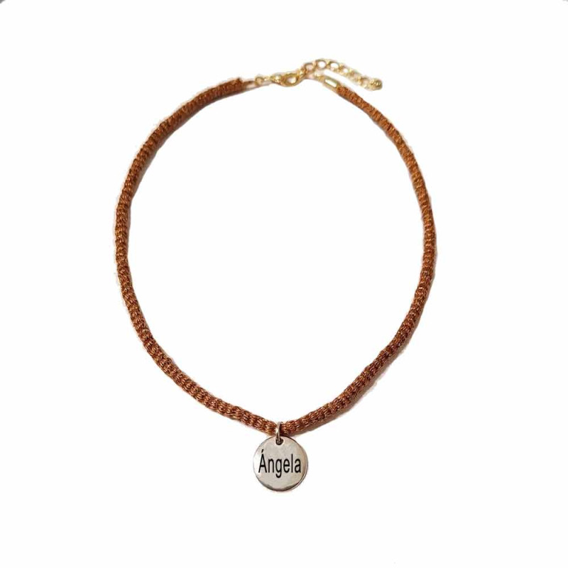 Personalized medal necklace with brown mesh.