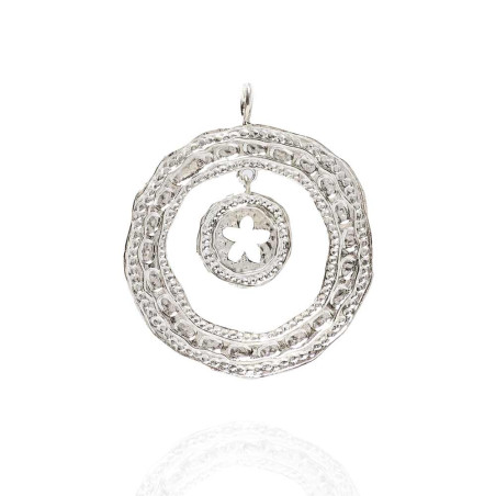 Silver pendant with a jasmine flower in the center and a textured finish