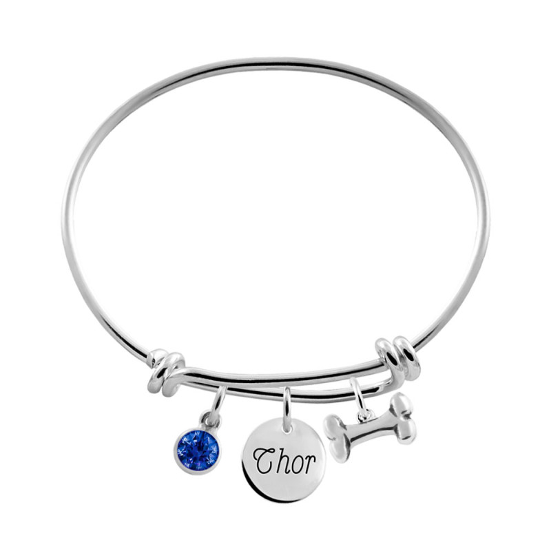 pulsera plata con charm hueso y circonita azul